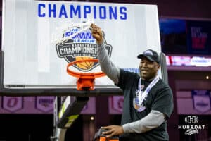 Omaha Maverick head coach Chris Cruchfield swings the net during the Summit League Tournament Finals Sunday, March 9, 2025 in Sioux Falls, South Dakota. Photo by John S. Peterson.