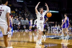 Omaha Maverick guard Tony Osburn (32) celebrates the win over the St. Thomas Tommies during the Summit League Tournament Finals Sunday, March 9, 2025 in Sioux Falls, South Dakota. Photo by John S. Peterson.