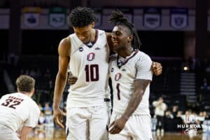 Omaha Mavericks Marquel Sutton (10) and JJ White celebrate the win over the St. Thomas Tommies during the Summit League Tournament Finals Sunday, March 9, 2025 in Sioux Falls, South Dakota. Photo by John S. Peterson.