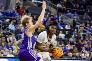 Omaha Maverick guard JJ White (1) looks to make a lay up against St. Thomas Tommies guard Drake Dobbs (11) in the second half during the Summit League Tournament Finals Sunday, March 9, 2025 in Sioux Falls, South Dakota. Photo by John S. Peterson.