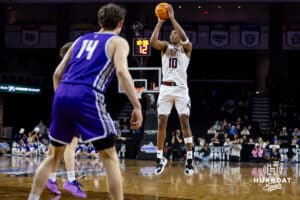 Omaha Maverick guard Lance Waddles (7) makes a three-point shot against the St. Thomas Tommies in the second half during the Summit League Tournament Finals Sunday, March 9, 2025 in Sioux Falls, South Dakota. Photo by John S. Peterson.
