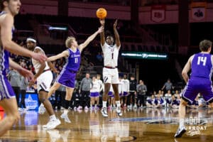 Omaha Maverick guard JJ White (1) makes a three-point shot against St. Thomas Tommies guard Drake Dobbs (11) in the second half during the Summit League Tournament Finals Sunday, March 9, 2025 in Sioux Falls, South Dakota. Photo by John S. Peterson.