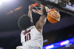 Omaha Maverick forward Marquel Sutton (10) makes a dunk against the St. Thomas Tommies in the first half during the Summit League Tournament Finals Sunday, March 9, 2025 in Sioux Falls, South Dakota. Photo by John S. Peterson.