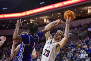 Omaha Maverick forward Joshua Streit (23) reaches for a rebouind against St. Thomas Tommies guard Kendall Blue (1) in the first half during the Summit League Tournament Finals Sunday, March 9, 2025 in Sioux Falls, South Dakota. Photo by John S. Peterson.
