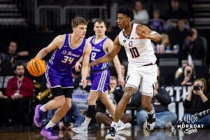 Omaha Maverick forward Marquel Sutton (10) defends against St. Thomas Tommies guard Ben Oosterbaan (34) in the first half during the Summit League Tournament Sunday, March 9, 2025 in Sioux Falls, South Dakota. Photo by John S. Peterson.