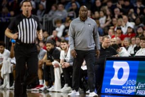 Omaha Maverick head coach Chris Cruchfield watches the action on the court against the St. Thomas Tommies in the first half during the Summit League Tournament Finals Sunday, March 9, 2025 in Sioux Falls, South Dakota. Photo by John S. Peterson.