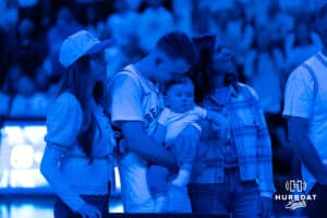 Creighton Bluejays Steven Ashworth kisses his son after a college basketball game against Butler on March 8th, 2025 in Omaha Nebraska. Photo by Brandon Tiedemann.