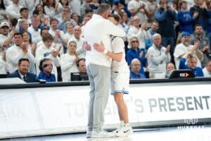 Creighton Bluejays Greg McDermott hugs senior Steven Ashworth during a college basketball game against Butler on March 8th, 2025 in Omaha Nebraska. Photo by Brandon Tiedemann.