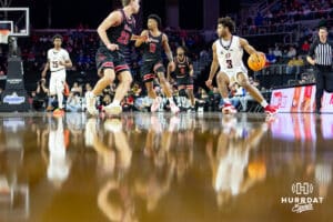 Nebraska-Omaha Maverick guard Grant Stubblefield (3) dribbles the ball agalnst South Dakota Coyote guard Paul Bruns (23) during the Summit League Tournament Saturday, March 8, 2025 in Sioux Falls, South Dakota. Photo by John S. Peterson.