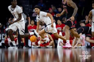 Nebraska-Omaha Maverick guard Lance Waddles (7) dribbles the ball against the South Dakota Coyotes in the second half during the Summit League Tournament Saturday, March 8, 2025 in Sioux Falls, South Dakota. Photo by John S. Peterson.