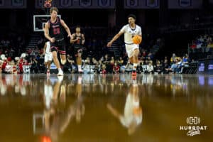 Nebraska-Omaha Maverick guard Lance Waddles (7) brings the ball down the court against South Dakota Coyote guard Paul Bruns (23) in the second half during the Summit League Tournament Saturday, March 8, 2025 in Sioux Falls, South Dakota. Photo by John S. Peterson.