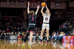 Nebraska-Omaha Mavericks guard Tony Osburn (32) makes a three-point shot against the South Dakota Coyotes in the second half during the Summit League Tournament Saturday, March 8, 2025 in Sioux Falls, South Dakota. Photo by John S. Peterson.