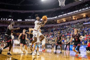 Nebraska-Omaha Maverick guard JJ White (1) makes a lay up against the South Dakota Coyotes in the first half during the Summit League Tournament Saturday, March 8, 2025 in Sioux Falls, South Dakota. Photo by John S. Peterson.