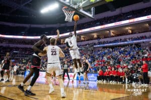 Nebraska-Omaha Maverick guard Ja'Sean Glover (5) makes a lay up against the South Dakota Coyotes in the first half during the Summit League Tournament Saturday, March 8, 2025 in Sioux Falls, South Dakota. Photo by John S. Peterson.