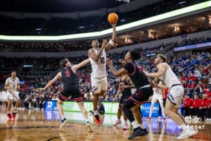 Nebraska-Omaha Maverick forward Marquel Sutton (10) makes a lay up against the South Dakota Coyotes during the Summit League Tournament Saturday, March 8, 2025 in Sioux Falls, South Dakota. Photo by John S. Peterson.