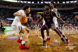 Nebraska-Omaha Maverick guard Lance Waddles (7) dribbles the ball against South Dakota Coyote guard Chase Forte (9) in the first half during the Summit League Tournament Saturday, March 8, 2025 in Sioux Falls, South Dakota. Photo by John S. Peterson.