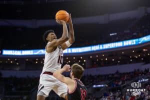 Nebraska-Omaha Maverick forward Marquel Sutton (10) goes for a lay up against South Dakota Coyote guard Isaac Bruns (12) during the Summit League Tournament Saturday, March 8, 2025 in Sioux Falls, South Dakota. Photo by John S. Peterson.