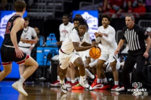 Nebraska-Omaha Maverick guard JJ White (1) dribbles the ball against South Dakota Coyote guard Isaac Bruns (12) inthe first half during the Summit League Tournament Saturday, March 8, 2025 in Sioux Falls, South Dakota. Photo by John S. Peterson.