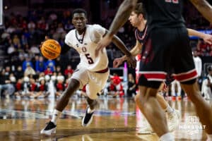 Nebraska-Omaha Maverick guard Ja'Sean Glover (5) dribbles the ball against the South Dakota Coyotes in the first half during the Summit League Tournament Saturday, March 8, 2025 in Sioux Falls, South Dakota. Photo by John S. Peterson.