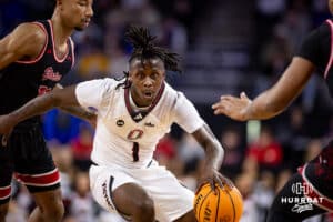 Nebraska-Omaha Maverick guard JJ White (1) dribbles the against the South Dakota Coyotes in the first half during the Summit League Tournament Saturday, March 8, 2025 in Sioux Falls, South Dakota. Photo by John S. Peterson.