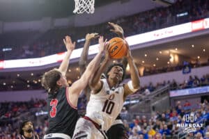 Nebraska-Omaha Maverick forward Marquel Sutton (10) fouled going for a basket against the South Dakota Coyotes in the first half during the Summit League Tournament Saturday, March 8, 2025 in Sioux Falls, South Dakota. Photo by John S. Peterson.