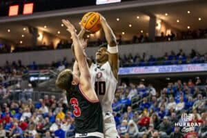 Nebraska-Omaha Maverick forward Marquel Sutton (10) makes a jump shot against South Dakota Coyote guard Max Burchill (3) in the first half during the Summit League Tournament Saturday, March 8, 2025 in Sioux Falls, South Dakota. Photo by John S. Peterson.