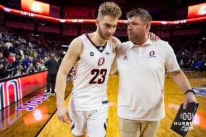 Nebraska-Omaha Mavericks forward Joshua Streit (23) and the assciate head coach Kyan Brown wlak off the court together after the win over the UMKC Kangaroos during the Summit League Tournament Thursday, March 6, 2025 in Lincoln, Nebraska. Photo by John S. Peterson.