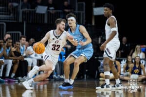 Nebraska-Omaha Mavericks guard Tony Osburn (32) dribbles the ball against UMKC Kangaroos guard Jamar Brown (5) during the Summit League Tournament Thursday, March 6, 2025 in Lincoln, Nebraska. Photo by John S. Peterson.
