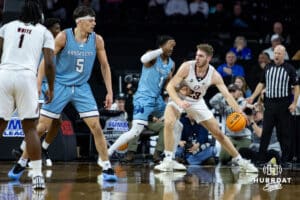 Nebraska-Omaha Mavericks forward Marquel Sutton (10) makes a lay up against UMKC Kangaroos forward Josh Ijeh (21) during the Summit League Tournament Thursday, March 6, 2025 in Lincoln, Nebraska. Photo by John S. Peterson.
