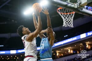 Nebraska-Omaha Mavericks forward Marquel Sutton (10) makes a lay up against UMKC Kangaroos forward Josh Ijeh (21) during the Summit League Tournament Thursday, March 6, 2025 in Lincoln, Nebraska. Photo by John S. Peterson.