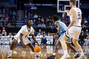 Nebraska-Omaha Mavericks guard JJ White (1) dribbles the ball against UMKC Kangaroos guard Babacar Diallo (2) in the first half during the Summit League Tournament Thursday, March 6, 2025 in Lincoln, Nebraska. Photo by John S. Peterson.