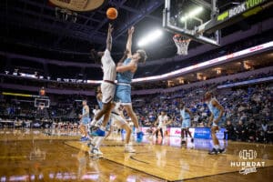 Nebraska-Omaha Mavericks guard JJ White (1) puts up a lay up against UMKC Kangaroos guard Cameron Faas (30) in the first half during the Summit League Tournament Thursday, March 6, 2025 in Lincoln, Nebraska. Photo by John S. Peterson.