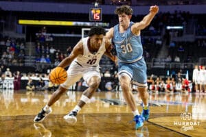 Nebraska-Omaha Mavericks forward Marquel Sutton (10) dribbles the ball against UMKC Kangaroos guard Cameron Faas (30) during the Summit League Tournament Thursday, March 6, 2025 in Lincoln, Nebraska. Photo by John S. Peterson.