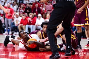 Nebraska Cornhusker forward Juwan Gary (4) dives for the loose ball and calls timeout against the Minnesota Golden Gophers in the second half during a men’s college basketball game Saturday, March 1, 2025 in Lincoln, Nebraska. Photo by John S. Peterson.