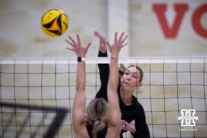 Nebraska Cornhusker Andi Jackson (11) spikes the ball against the Ottawa Braves during a college beach volleyball match Tuesday, March 4, 2025 in Lincoln, Nebraska. Photo by John S. Peterson.