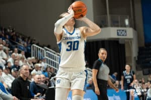 Creighton Bluejays Morgan Maly shoots a three during a college basketball game against Villanova on March 2nd, 2025 in Omaha Nebraska. Photo by Brandon Tiedemann.