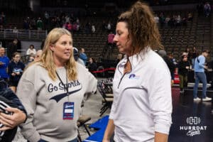 Omaha Supernovas head coach Laura "Bird" Kuhn talks to the new Nebraska Cornhusker head coach Dani Busboom-Kelly after the win over the Indy Ignite during a professional volleyball match Sunday, March 2, 2025 in Omaha, Nebraska. Photo by John S. Peterson.