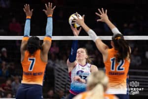 Omaha Supernovas Emily Londot (27) bumps the ball over Indy Ingite Leketor Member-Meneh (7) and Caroline Crawford (12) in the second set during a professional volleyball match Sunday, March 2, 2025 in Omaha, Nebraska. Photo by John S. Peterson.