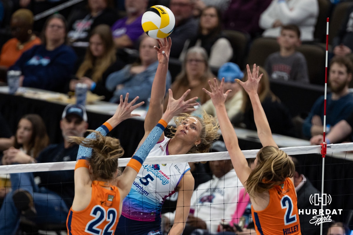Omaha Supernovas Brooke Nuneviller (5) taps the ball over Indy Ingite Lydia Martyn (22) and Sydney Hilley (2) in the second set during a professional volleyball match Sunday, March 2, 2025 in Omaha, Nebraska. Photo by John S. Peterson.