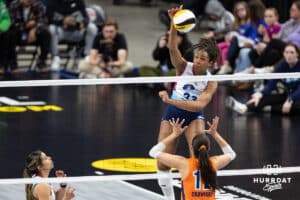 Omaha Supernovas Kaitlyn Hord (23) spikes the ball against Indy Ingite Caroline Crawford (12) in the second set during a professional volleyball match Sunday, March 2, 2025 in Omaha, Nebraska. Photo by John S. Peterson.