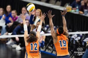 Omaha Supernovas Reagan Cooper (8) spikes the ball Indy Ingite Caroline Crawford (12) and Azhani Tealer (19) in the second set during a professional volleyball match Sunday, March 2, 2025 in Omaha, Nebraska. Photo by John S. Peterson.