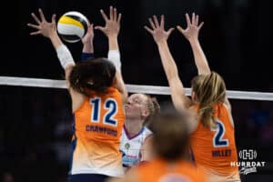 Omaha Supernovas Emily Londot (27) spikes the ball against Indy Ingite Caroline Crawford (12) and Sydney Hilley (2) in the first set during a professional volleyball match Sunday, March 2, 2025 in Omaha, Nebraska. Photo by John S. Peterson.