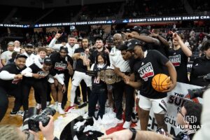 Omaha Mavericks celebrate with Joanne Li after a college basketball game against Oral Roberts on March 1st, 2025 in Omaha Nebraska. Photo by Brandon Tiedemann.