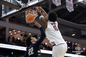 Omaha Mavericks Marquel Sutton dunks on someone during a college basketball game against Oral Roberts on March 1st, 2025 in Omaha Nebraska. Photo by Brandon Tiedemann.