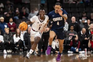 Omaha Mavericks JJ White pushes the ball up court during a college basketball game against Oral Roberts on March 1st, 2025 in Omaha Nebraska. Photo by Brandon Tiedemann.