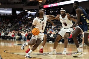 Omaha Mavericks JJ White drives to the basket during a college basketball game against Oral Roberts on March 1st, 2025 in Omaha Nebraska. Photo by Brandon Tiedemann.