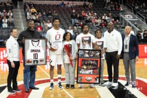 maha Mavericks Marquel Sutton with family on senior day before a college basketball game against Oral Roberts on March 1st, 2025 in Omaha Nebraska. Photo by Brandon Tiedemann.