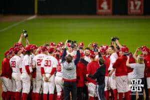 Nebraska Cornhuskers huddle up after the walk-off win over the Kansas St. Wildcats during a college baseball game Tuesday, April 29, 2025 in Lincoln, Nebraska. Photo by John S. Peterson.