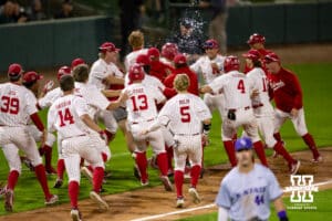 Nebraska Cornhuskers celebrate the walk-off win over the Kansas St. Wildcats during a college baseball game Tuesday, April 29, 2025 in Lincoln, Nebraska. Photo by John S. Peterson.
