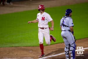 Nebraska Cornhusker infielder Dylan Carey (15) scores in the ninth for the walk-off win against the Kansas St. Wildcats during a college baseball game Tuesday, April 29, 2025 in Lincoln, Nebraska. Photo by John S. Peterson.